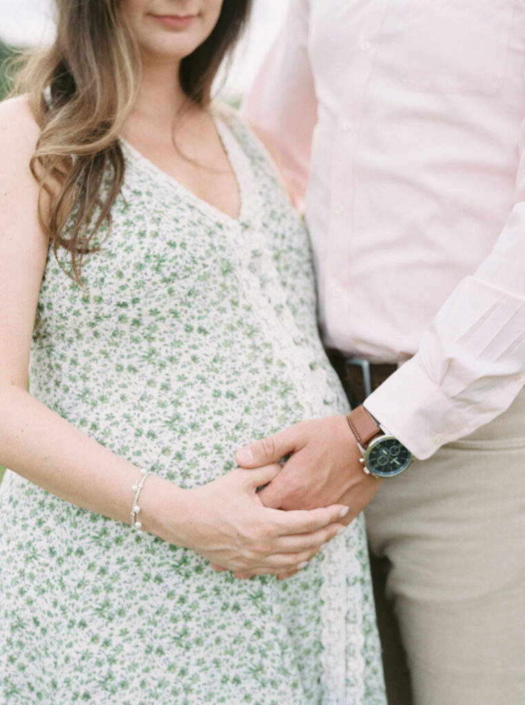 Expecting couple embracing during their Birmingham maternity session