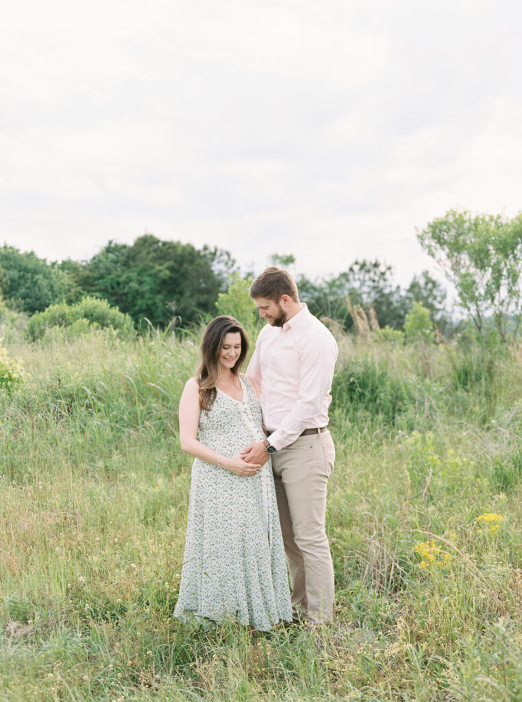 Expecting couple embracing during a maternity session in Birmingham