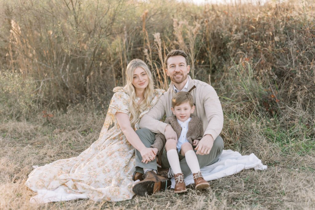 Family in coordinated fall outfits posing outdoors in Birmingham, Alabama