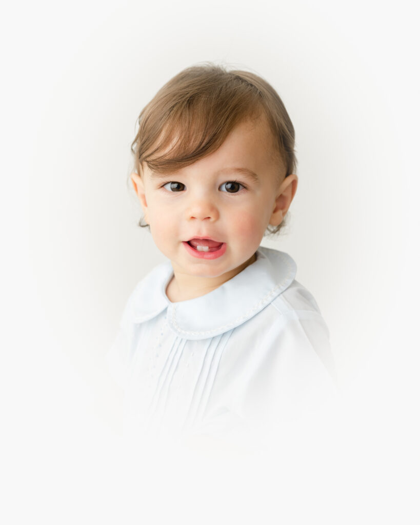 Close-up heirloom vignette portrait highlighting a child’s bright eyes and delicate features in Birmingham, AL
