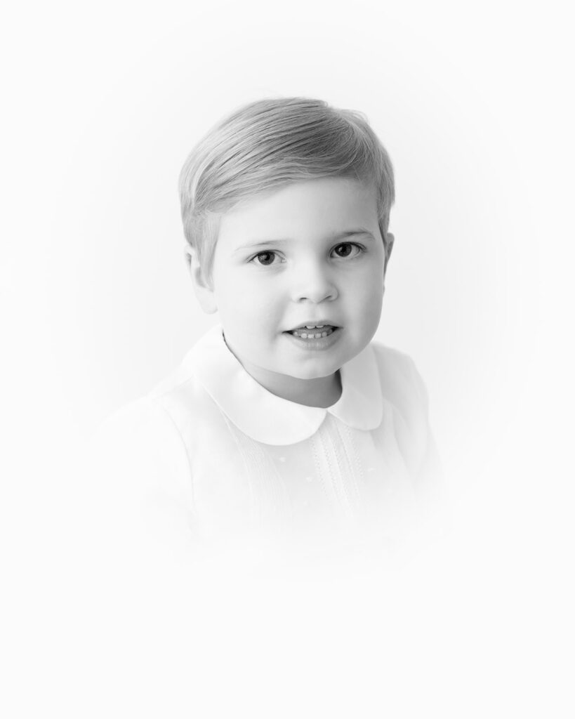 Black-and-white heirloom vignette portrait of a young child captured by Alice Claire Photography in Birmingham, AL