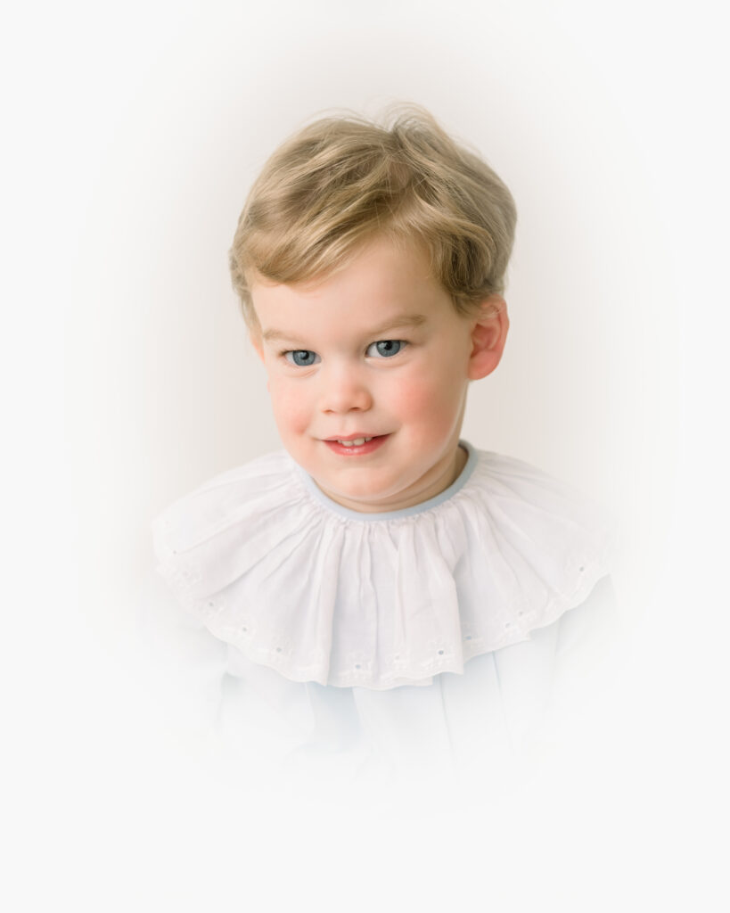 Fine-art heirloom vignette portrait of a child in Birmingham, AL by Alice Claire Photography — softly lit, timeless white background.