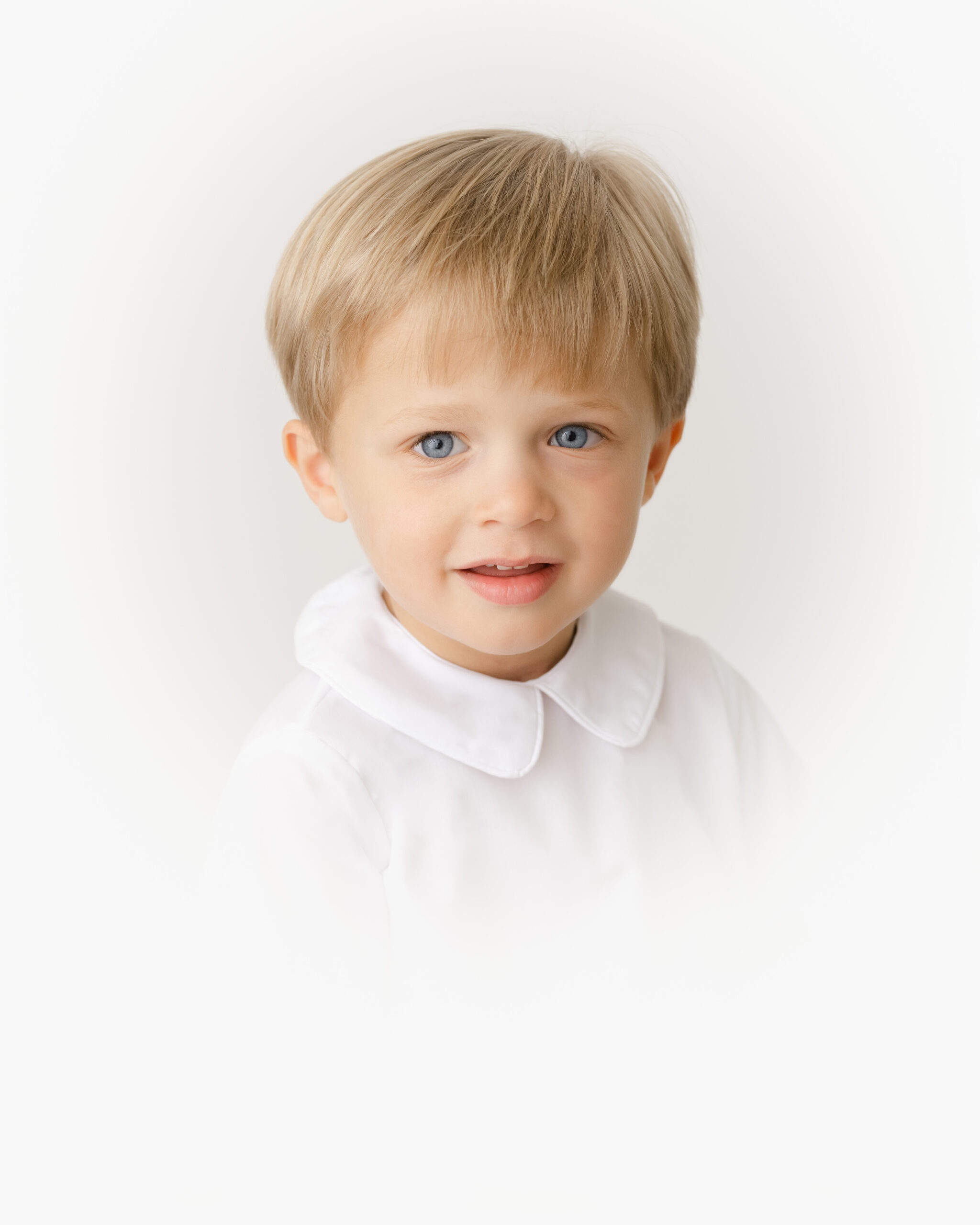 Heirloom portrait of a child bathed in soft natural light, emphasizing timeless fine-art style