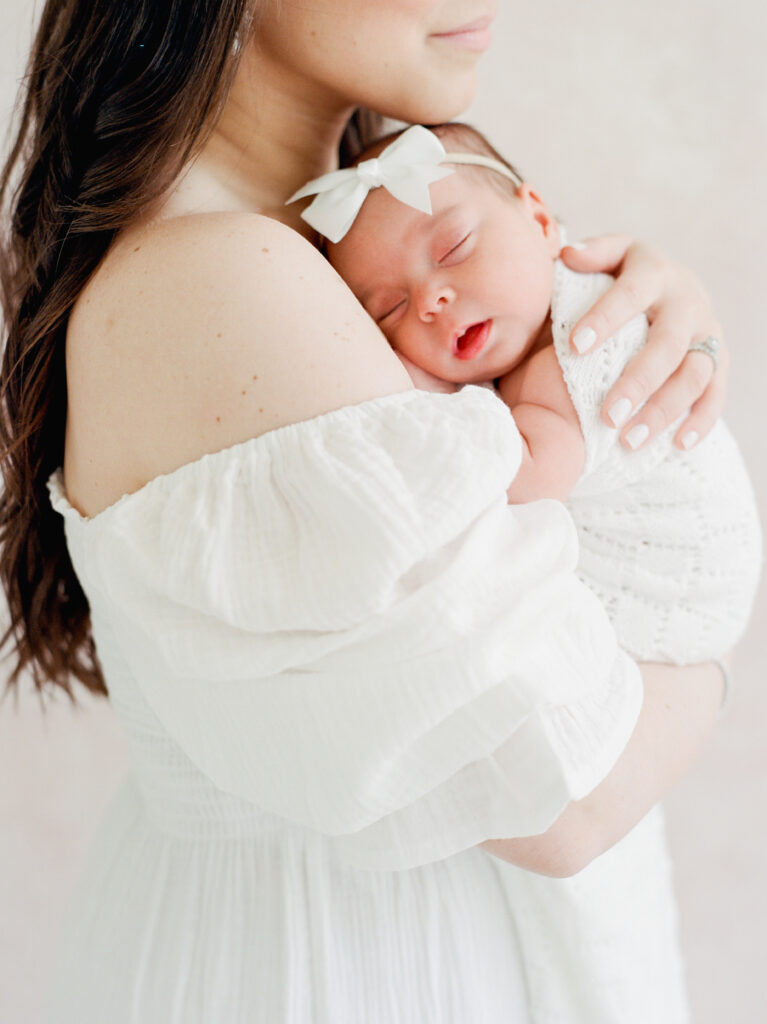 Bright, neutral studio newborn photography in Birmingham with classic, timeless baby portraits.