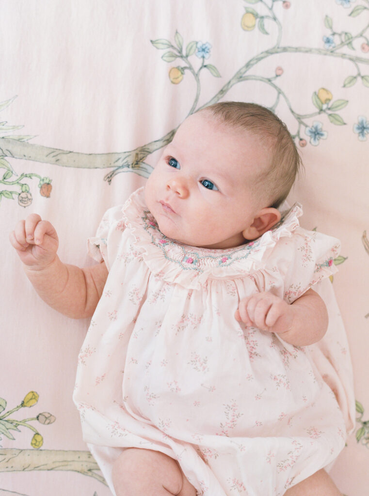 Lifestyle in-home newborn photography in Birmingham featuring natural light, soft posing, and heartfelt family moments.