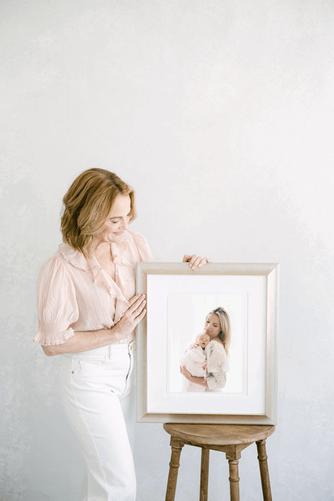 Custom newborn wall art designed to showcase timeless portraits in a Birmingham home.