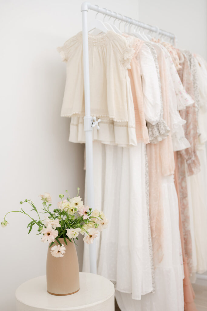 Curated client wardrobe available for mothers during a luxury newborn photography session