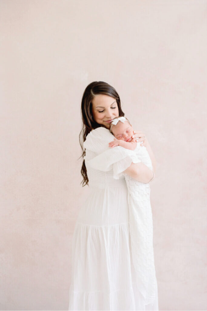 Neutral and elegant wardrobe options styled for a newborn session, photographed by a luxury Birmingham newborn photographer.
