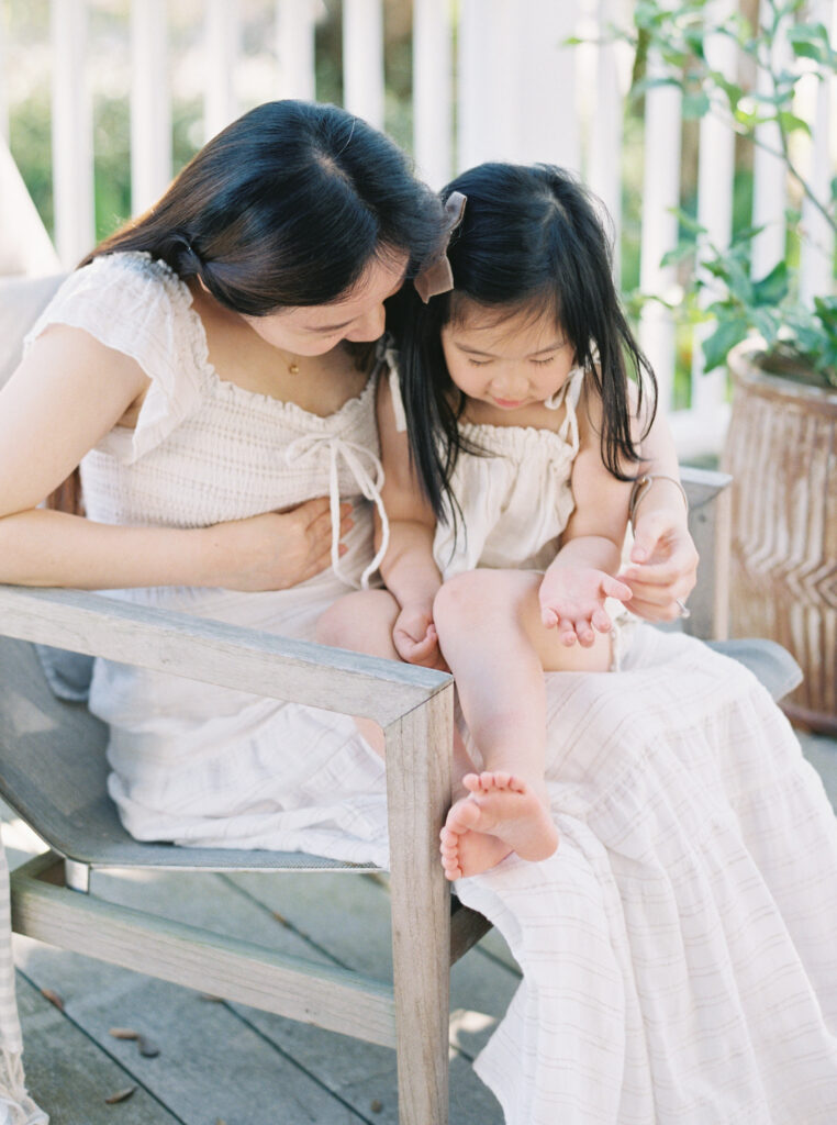 Pregnant mother with and toddler during a relaxed family maternity session in Birmingham, Alabama.